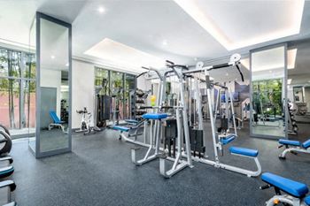 A gym with a lot of exercise equipment